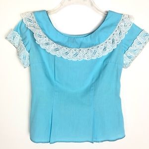 Vintage Desert Flowers Original light blue short sleeve lace top
Size XS/Small